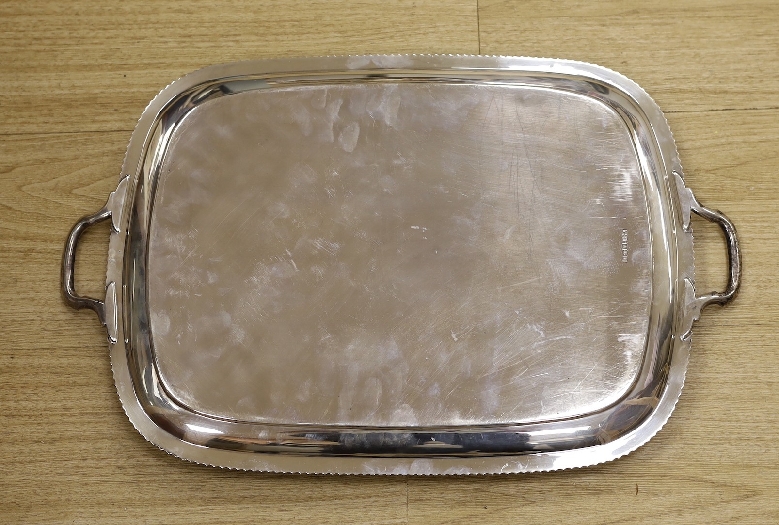 A George VI silver two handled rectangular tea tray, with gadrooned border, George Howson, Sheffield, 1937, 53.2cm, 58.5oz.